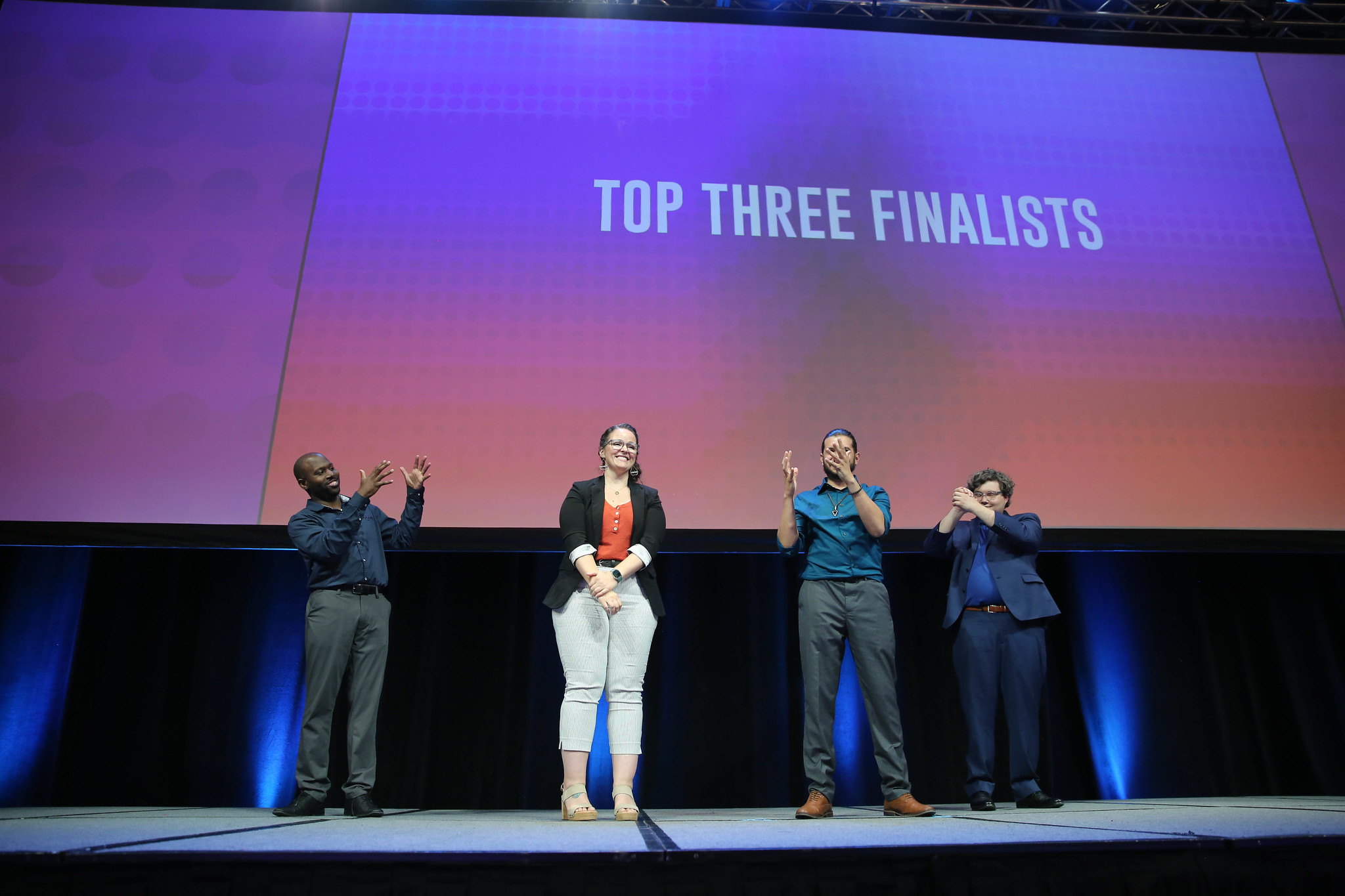 The announcement of three finalists on stage.
