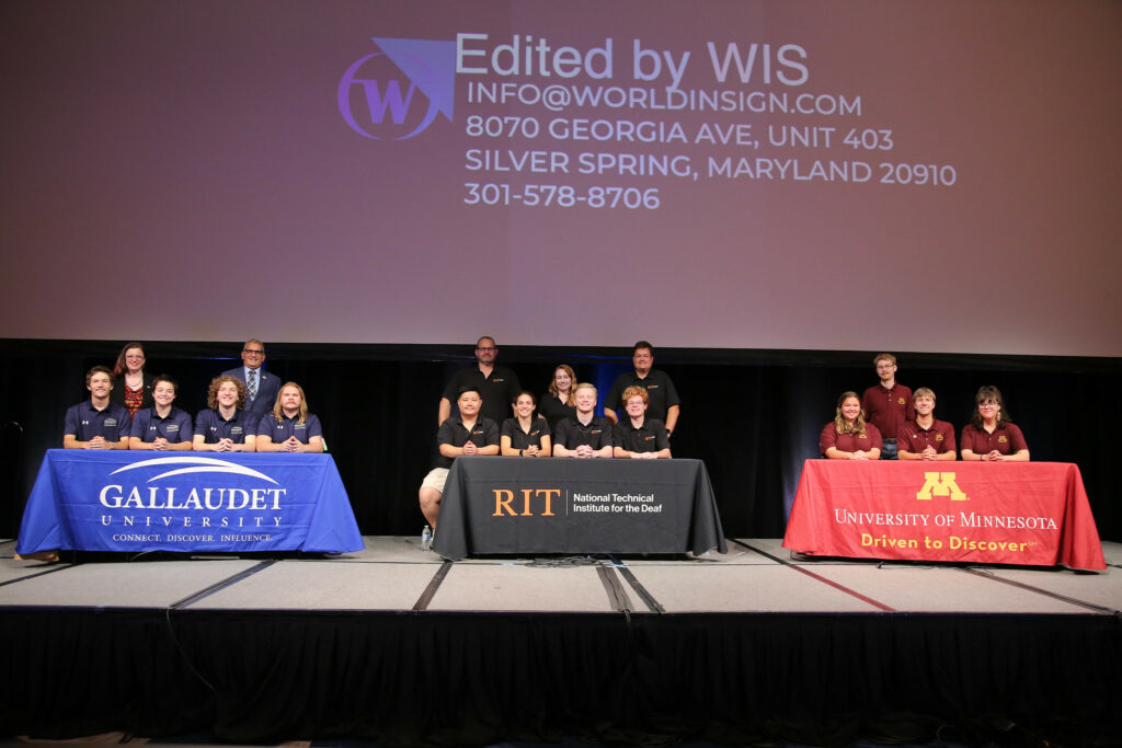 Three college bowl teams are on stage. L to R: Gallaudet University, Rochester Institute of Technology, and University of Minnesota